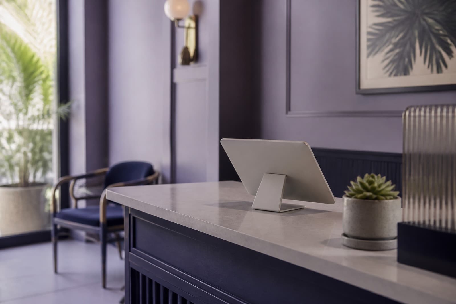 Tablet attendance kiosk on a reception desk for face recognition DTR